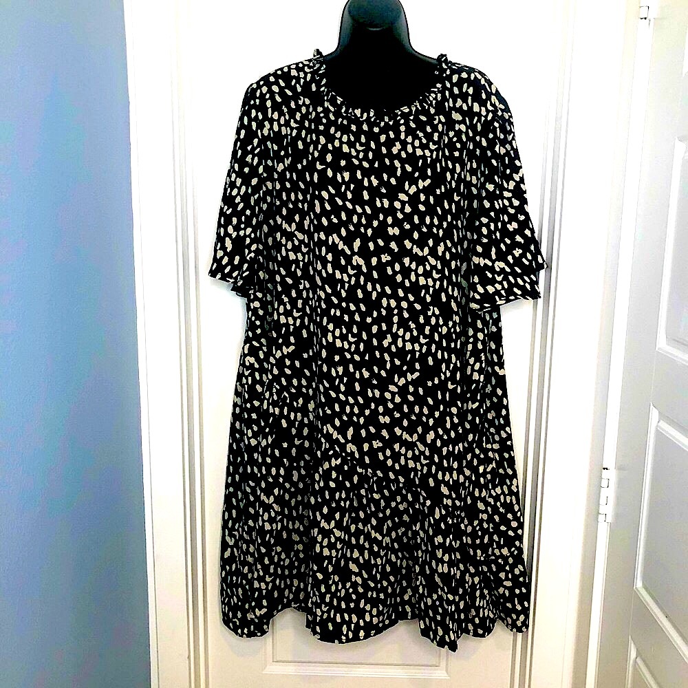 Beautiful A-line black/white print dress. Ruffled neckline and hem. never worn